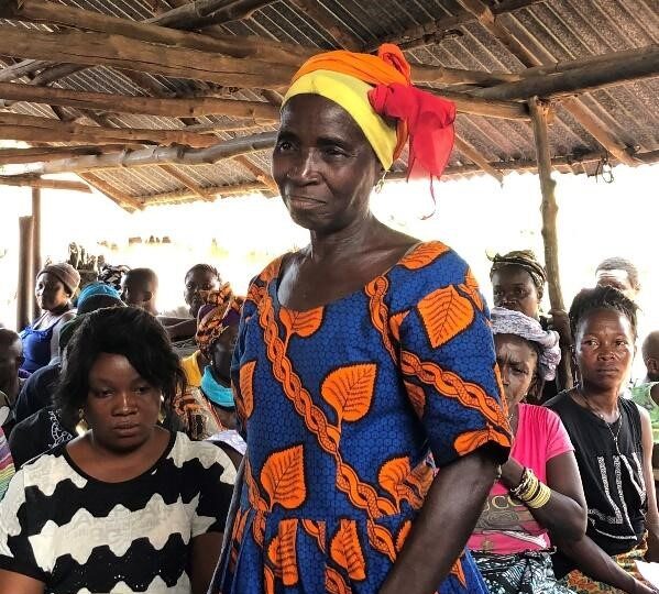 Woman in colourful dress and headwear